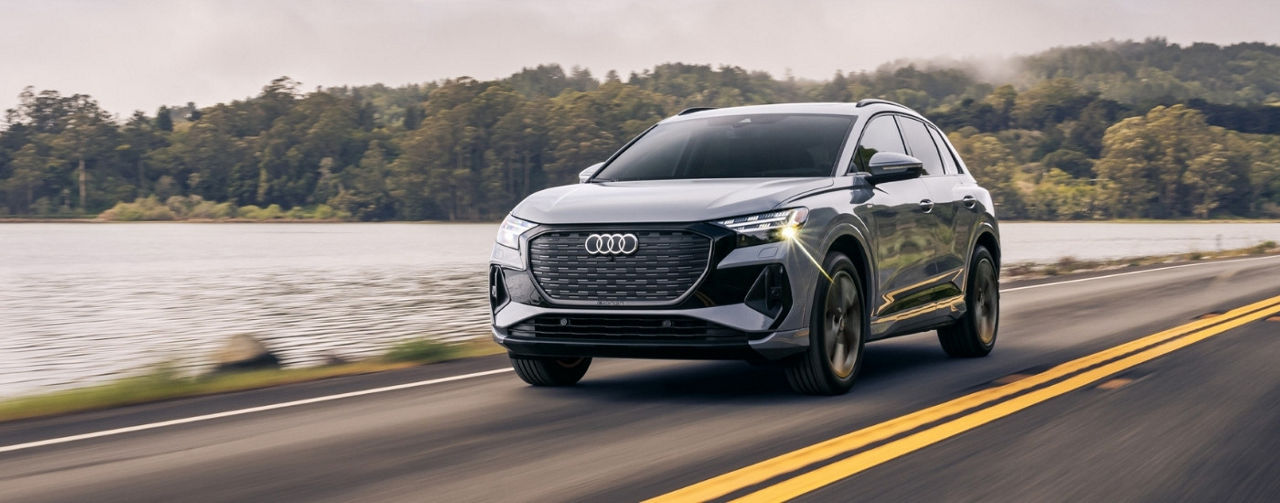 Grey 2024 Audi Q4 e-tron driving to a Audi dealer near Lexington